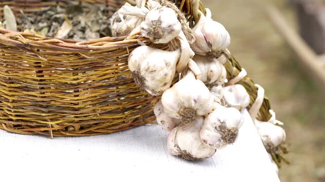 wicker basket and a bunch of garlic next to each other