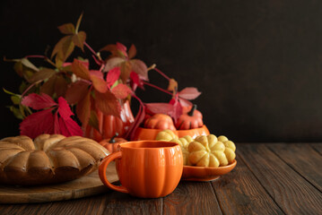 Autumn Composition with Pumpkin Mug, Bundt Cake and Seasonal Decor