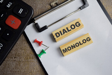 Dialog monolog on stacked wooden cubes on the table. Business and finance concept