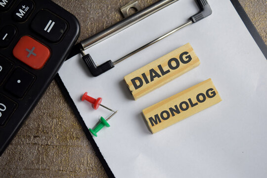 Dialog monolog on stacked wooden cubes on the table. Business and finance concept