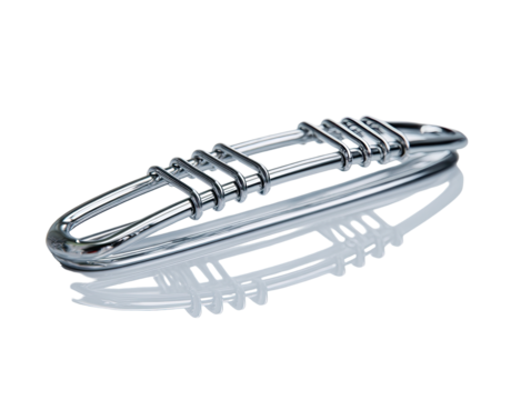 Polished metal object, elongated and sculpted, with intricate latticework