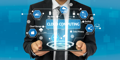 A businessman presents a tablet showcasing cloud computing graphics, emphasizing data protection, storage, and technology concepts against a vibrant blue background. Tessel