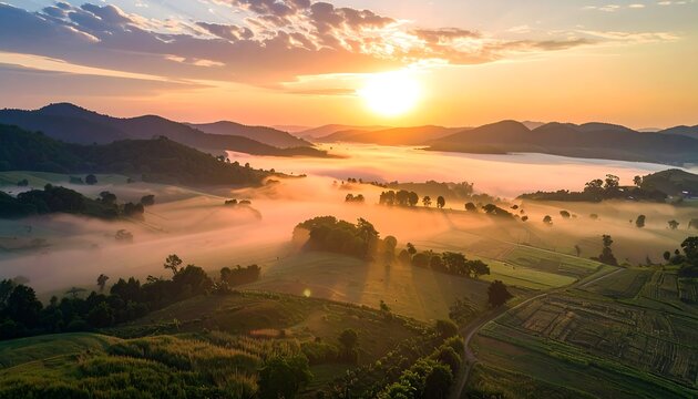 Sunrise over a misty valley