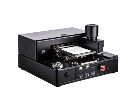 Advanced, black precision machine with integrated components.  A complex system for micro-processing or manipulation