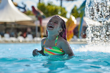 Joyful moments of a girl at the pool
