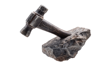 Hammer resting on a rock.  Dark metal hammerhead,  wooden handle,  grey rock base.  Studio shot, isolated
