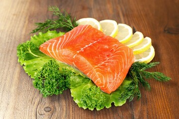 Raw tasty salmon fillets on desk