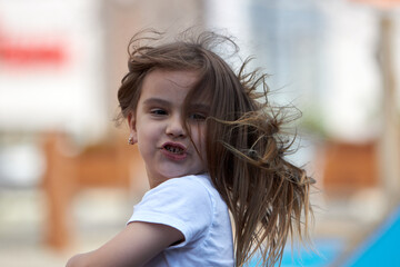 Fototapeta premium Little girl enjoying outdoor playtime