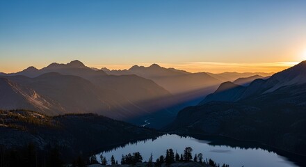 Obraz premium Majestic mountain landscape at sunrise and sunset, with morning mist and evening fog over the valleys