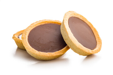 Sweet chocolate tartelettes isolated on white background.