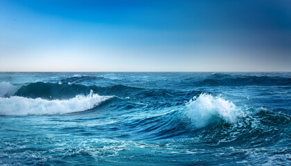 Vibrant Ocean Waves Dance Against A Calm Aqua Backdrop