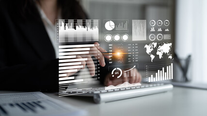 Business professional engages with innovative data visualization on laptop, focusing on charts and metrics in a modern office, illustrating insights and analytics trends. Impute