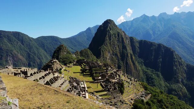 Panoramic view of Machu Picchu on a beautiful sunny day, The Valley of the Incas, Cuzco, Peru. Famous and tourist place in South America