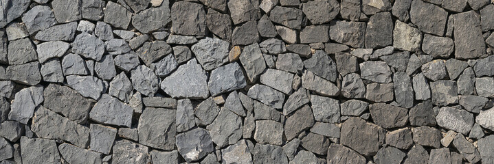 Panoramic texture of natural volcanic stone wall, Tenerife, Spain
