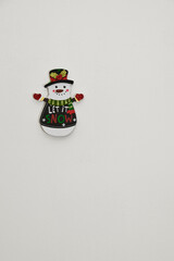 Images of a snowman as a Christmas decoration, close-up, with copy space.