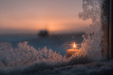 frostcovered window adorned with intricate icy patterns showcases solitary warm candle flickering inside