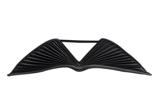 A stylized, dark object resembling wings or a book. Folded, pleated, and angular