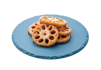 Golden-brown lotus root slices, glistening with sauce, are artfully arranged on a vibrant blue slate plate, against a black backdrop.