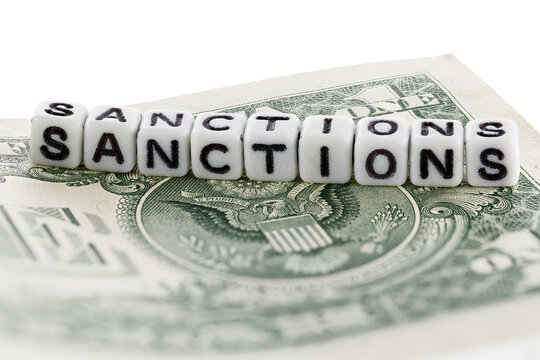 The inscription "Sanctions" on the American dollar. The concept of introducing economic sanctions.