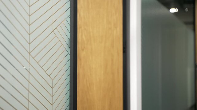 Close up of male hand unlocking a modern office door using mobile phone application. Businessman in suit scanning open smartphone with mock up screen app. Smart electronic locks with keyless access