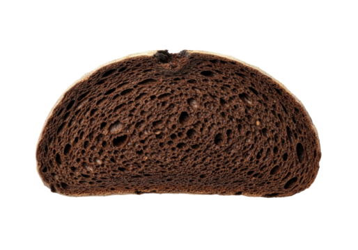 Substantial slice of artisanal dark rye bread with a dense crumb and rugged, intensely charred crust, isolated on a transparent studio background with copy space. Concept of rustic authenticity
