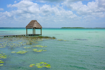 Bacalar, Mexico - May 21, 2025: Bacalar Lagoon is popularly known as the Lagoon of Seven Colors in Bacalar, Quintana Roo, Mexico.