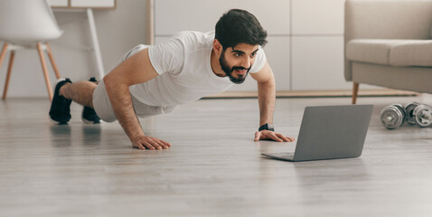 Healthy and body care on quarantine. Training at home. Attractive 30s young arabian man doing...
