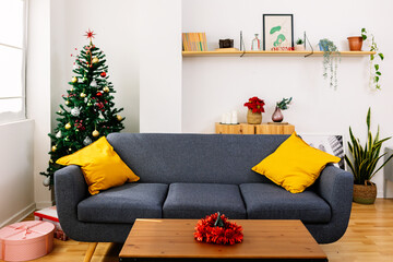 Decorated christmas tree adding a touch of magic to a cozy living room, creating a warm and...