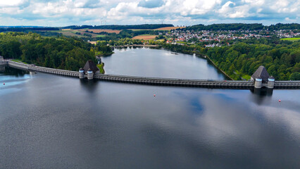 Fototapeta premium Aerial drone view of a huge stone dam on the lake Monetalsperre - Spermauer, Germany