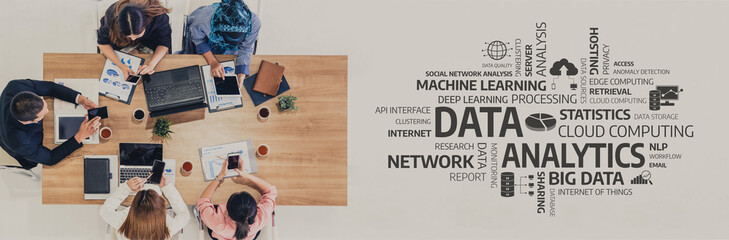 A diverse team collaborates at a modern workspace, focusing on data analytics, utilizing laptops and visual aids to drive insights and enhance decision-making processes. Tessel