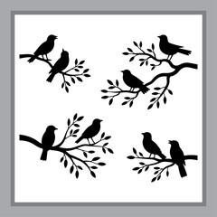 Obraz premium Birds Perched on Bare Branches: A Silhouette Depiction of Wildlife in Winter