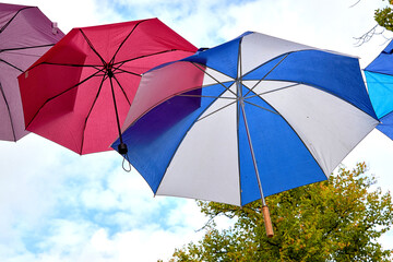 Colorful Umbrellas Hanging Against the Sky