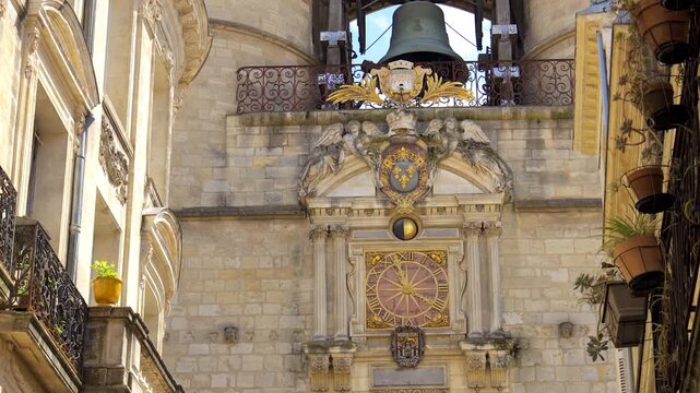 Coat of arms and clock of the Grosse Cloche in the center of Bordeaux, France