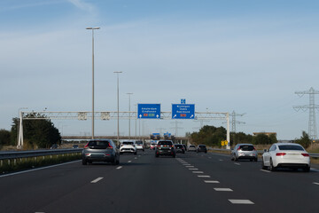 Road transportation in the Netherlands, Dutch highways, road signes, directions, driving car on multi line road, traffic jam in rush hours
