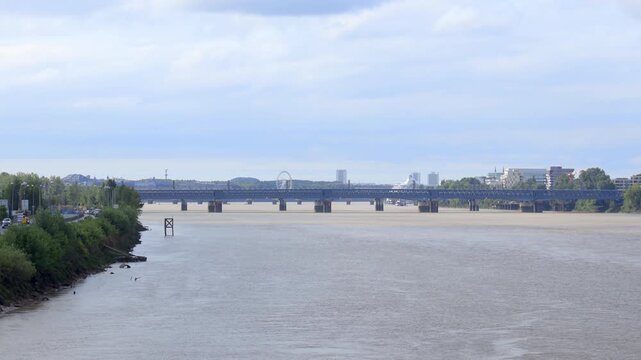 Eiffel footbridge and Saint-Jean bridge over the Garonne River in Bordeaux, France