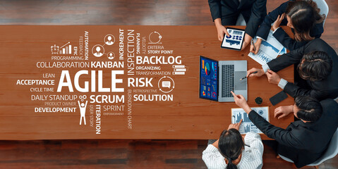 A top-down view of a team engaged in a collaborative agile meeting, discussing strategies and methodologies such as scrum and kanban for effective project and risk management. Amity