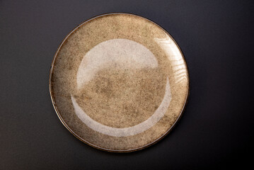 Beautiful plate, beautiful plate alone placed on a dark background, selective focus.