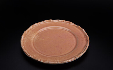 Beautiful plate, beautiful plate alone placed on a dark background, selective focus.