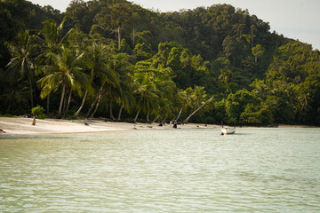 beautiful tropical beach with boats and scenic island landscape