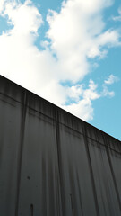 Weathered Concrete Wall with Sky View vertical