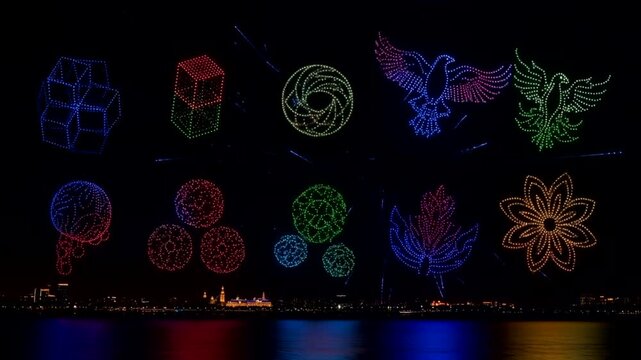 Spectacular Drone Light Show Illuminates Night Sky Over Water with Colorful Formations.
