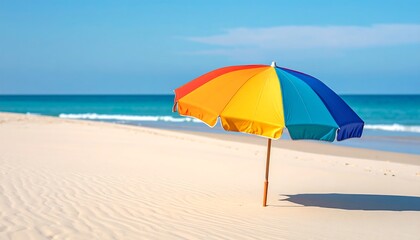 Colorful umbrella on a sandy beach