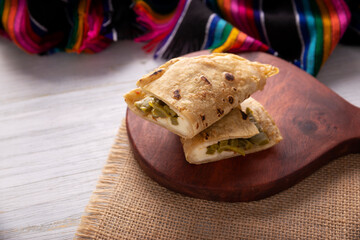 Cheese Quesadilla with nopales made on a Comal. Traditional Mexican street food 