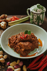 Spicy and tender beef rendang served on a plate with a mix of natural spices. Authentic Indonesian food (2)