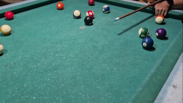 Time to line up the perfect shot on the billiard table.