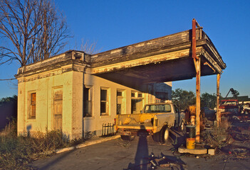 Late afternoon sun on old Route 66 era service station, McLean, Texas.  Most gas stations closed soon after Interstate 40 bypassed the town in 1984