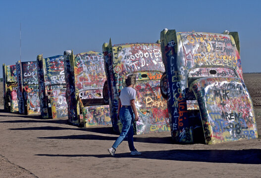 The iconic Cadillac Ranch was installed in 1974 and is an ever changing art installation at the whim of visitors with a spray can of paint, Old Route 66, Amarillo, Texas 