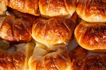 Delicious golden Argentine medialunas, buttery croissants with a soft texture and irresistible shine, perfect for breakfast or coffee time.