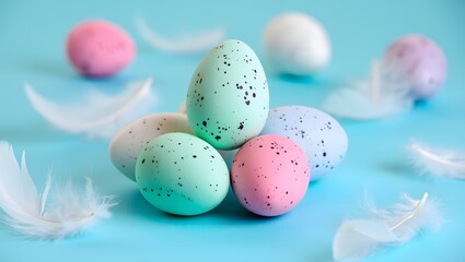 Obraz premium Pastel Easter eggs, delicate feathers, and a branch