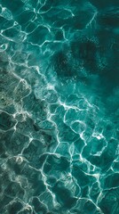 Obraz premium Sunlit Turquoise Water Surface with Caustics and Ripples Abstract Background
